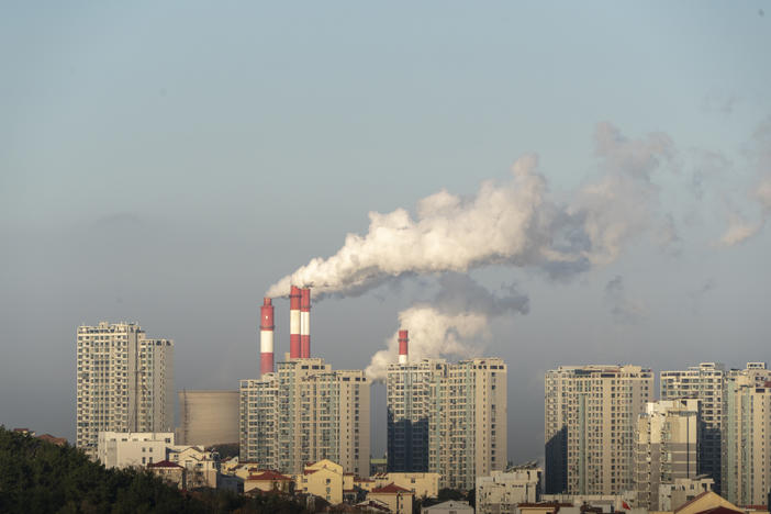 Smokestacks belch in Weihai, in China's Shandong province, in 2019. China is set to surpass pre-pandemic levels of carbon dioxide emissions this year.