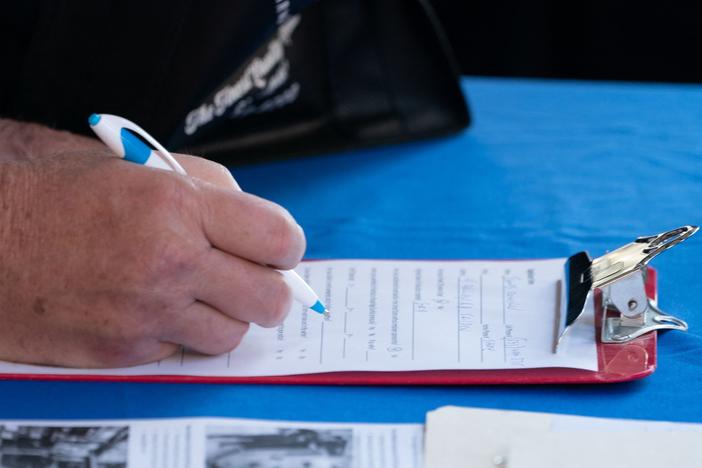 A man fills out an application at a booth at the Employers Only Long Island Food, Beverage and Hospitality Job Fair on Oct. 19 in Melville, N.Y. Employers added 531,000 jobs in October, marking a recovery after two months of weaker job growth.