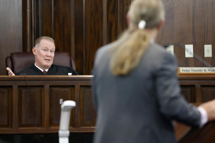 Judge Timothy Walmsley speaks to defense attorney Franklin Hogue during the jury selection process in the trial of the men charged with killing Ahmaud Arbery, at the Glynn County Superior Court in Brunswick, Ga., on Oct. 27.