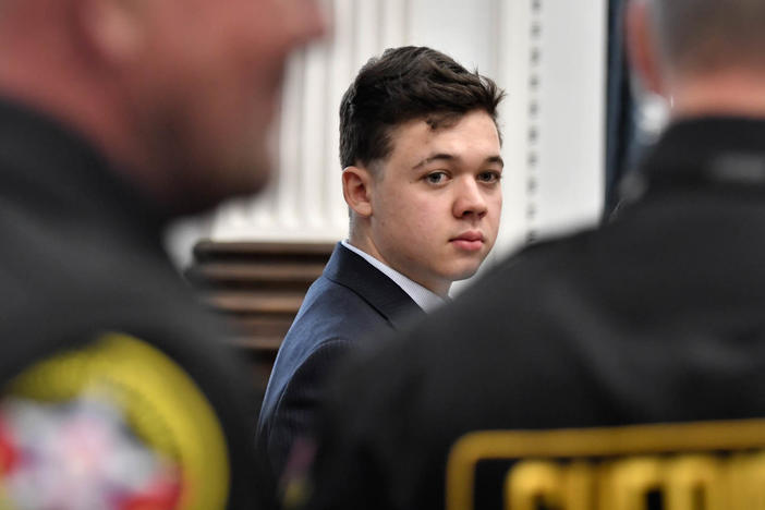 Kyle Rittenhouse, center, looks back as Kenosha County Sheriff's deputies enter the courtroom to escort him out of the room during a break in the trial at the Kenosha County Courthouse in Kenosha, Wis., on Friday, Nov. 5.