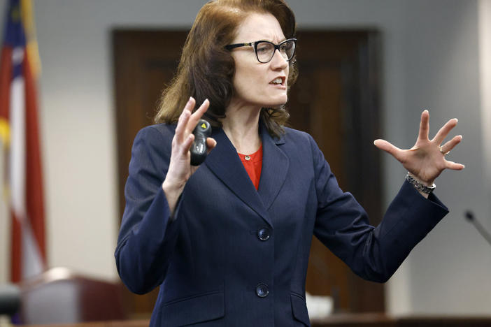 Prosecutor Linda Dunikoski speaks during opening statements in the trial of Gregory McMichael, his son, Travis McMichael, and a neighbor, William "Roddie" Bryan, at the Glynn County Courthouse on Friday in Brunswick, Ga. The three men are charged with the February 2020 slaying of 25-year-old Ahmaud Arbery.