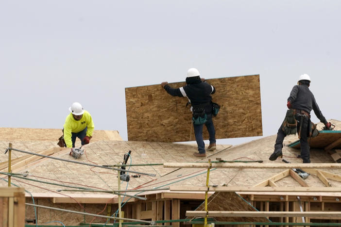 Home builders at work in Sacramento, Calif. Democrats in Congress are trying to pass a bill that would make the largest investment in affordable housing in history and try to boost construction of more moderately priced homes.