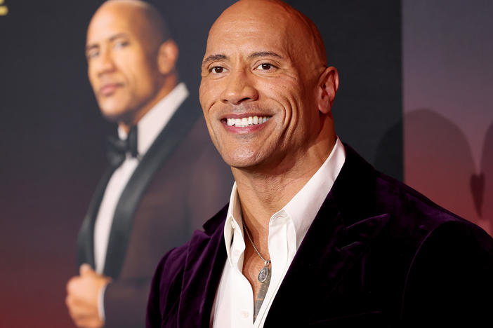 Dwayne Johnson attends the world premiere of Netflix's <em>Red Notice</em> on Wednesday in Los Angeles. Johnson says his production company will no longer use real guns on set.