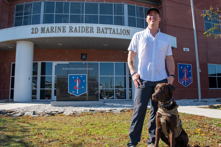 Nick Jones at Marine Corps Base Camp Lejeune in Jacksonville, N.C., on Nov. 8 with his dog Fletcher. This Veterans Day will be Nick's first day as a civilian upon leaving the Marine Corps.