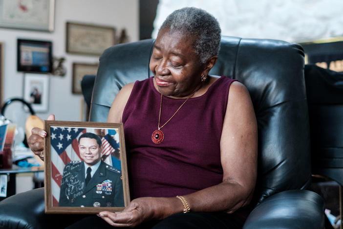 Retired Brigadier Gen. Clara Adams-Ender, the first woman to receive her master's degree in military arts and sciences from the U.S. Army Command and General Staff College holds a signed photo of Gen. Colin Powell, the first African American chairman of the Joint Chiefs of Staff.