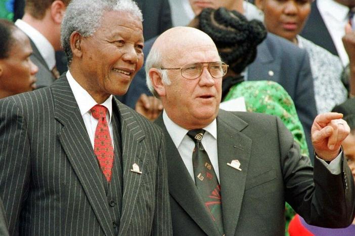 South African President Nelson Mandela, left, and Deputy President F.W. de Klerk chat on May 8, 1996, outside Parliament after the approval of South Africa's new constitution. F.W. de Klerk, who oversaw the end of South Africa's country's white minority rule, has died at 85 it was announced Thursday.