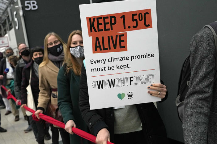 Climate activists demonstrate at the COP26 U.N. Climate Summit in Glasgow, Scotland, Friday. Negotiators from almost 200 nations were making a fresh push to reach agreement on a series of key issues.