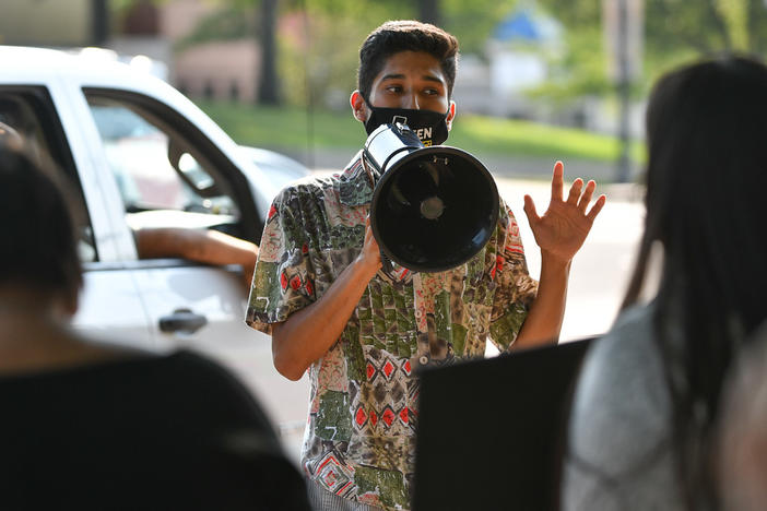 University of Kansas undergraduate Marc Veloz speaks at an environmental rally outside Lawrence city hall. He says his interest in activism was driven by concern over the disproportionate effect climate change had on communities of color in his hometown of Dallas.