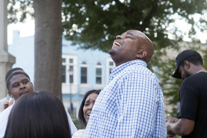 Dontae Sharpe reacts outside the Pitt County Courthouse after a judge determined he could be set free on Aug. 22, 2019, in Greenville, N.C. North Carolina Gov. Roy Cooper on Friday pardoned Sharpe, who spent 24 years behind bars for a murder he has long said he did not commit.