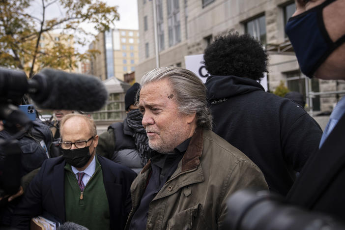 Former Trump administration adviser Steve Bannon surrenders at the FBI Washington Field Office in Washington, D.C., on Monday. He's been charged with two counts of contempt of Congress for defying a subpoena from the Jan. 6 committee.