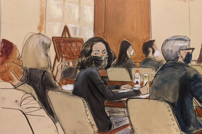 In this courtroom sketch, Ghislaine Maxwell looks over her shoulder to the courtroom audience prior to the start of jury selection in her trial on Nov. 16, 2021 in New York. Prospective jurors got their first glimpse of Maxwell, the British socialite charged with helping Jeffrey Epstein sexually abuse girls and women, when a judge began questioning them.
