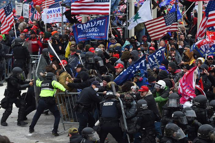 Trump supporters clash with police and security forces during the insurrection at the Capitol on Jan. 6.