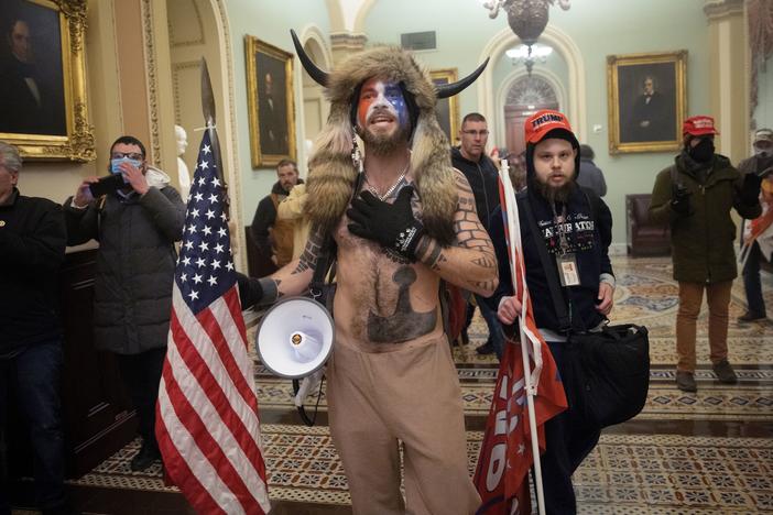 Jacob Chansley, the self-styled "QAnon shaman," confronts U.S. Capitol Police officers during the Jan. 6 insurrection.