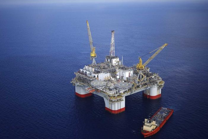 A supply ship sits anchored next to the Chevron Corp. Jack/St. Malo deepwater oil platform in the Gulf of Mexico in May 2018. The Biden administration is auctioning millions of acres of the Gulf for oil and gas lease sales.