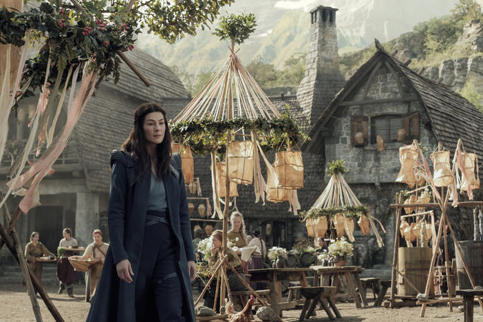 Moiraine (Rosamund Pike) visits a remote village in search of something — or someone — in Amazon's <em>The Wheel of Time</em>.