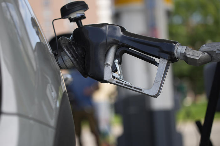 Motorists fill up their vehicles at a Shell station on July 22 in Denver. Phasing out the sale of gas-powered cars once seemed laughable. It's now inching closer to reality.