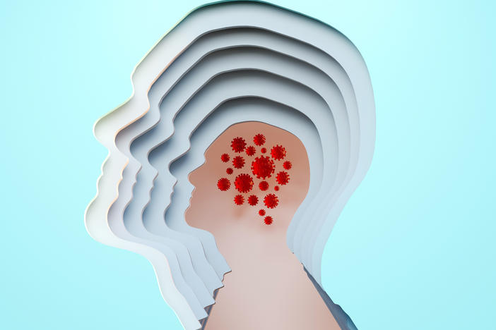 Digital generated image of cut out male head multilayered with covid-19 cells inside on blue background.