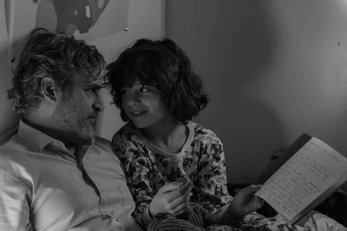 Joaquin Phoenix as Johnny and Woody Norman as Jesse in <em>C'mon C'mon. </em>
