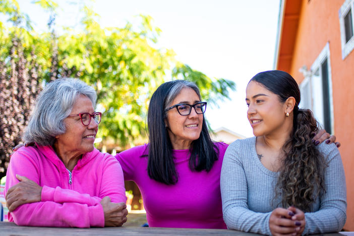 Three generations, (from left to right) grandmother Genoveva Calloway, daughter Petra Gonzales, and granddaughter Vanesa Quintero, live next door to each other in San Pablo, Calif. Recently their extended family was hit with a second wave of COVID infections a year after the first.