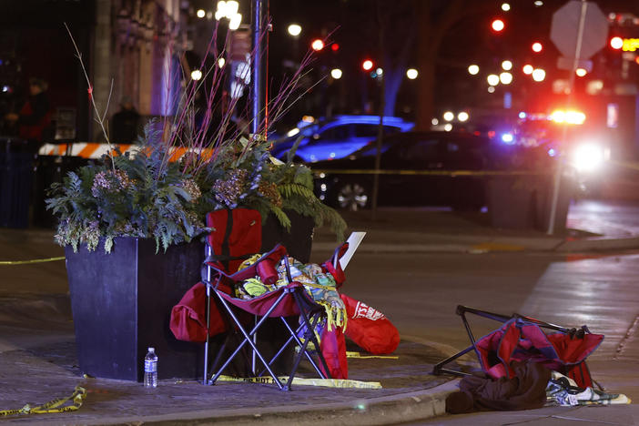 Toppled chairs are seen among holiday decorations in downtown Waukesha, Wis., after an SUV plowed into a Christmas parade injuring dozens of people Sunday.