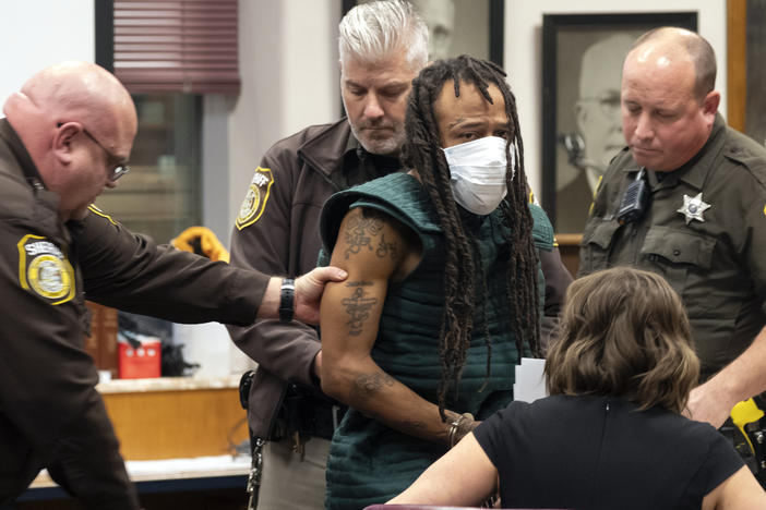 Darrell Brooks Jr. makes his initial court appearance on Tuesday in Waukesha, Wis. Prosecutors in Wisconsin have charged Brooks with intentional homicide in the deaths of at least five people who were killed when an SUV was driven into a Christmas parade.