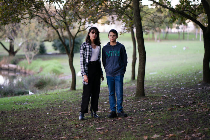 Sixteen-year-old Sofia (left) and 13-year-old André Oliveira stand in Parque da Paz in Lisbon. The siblings are two of six young people in Portugal who are suing the governments of Europe's most polluting countries, including their own, to force them to cut emissions.