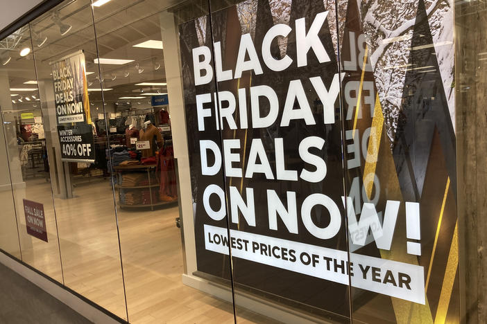 A sign promote sales at a clothing store in a Colorado mall.