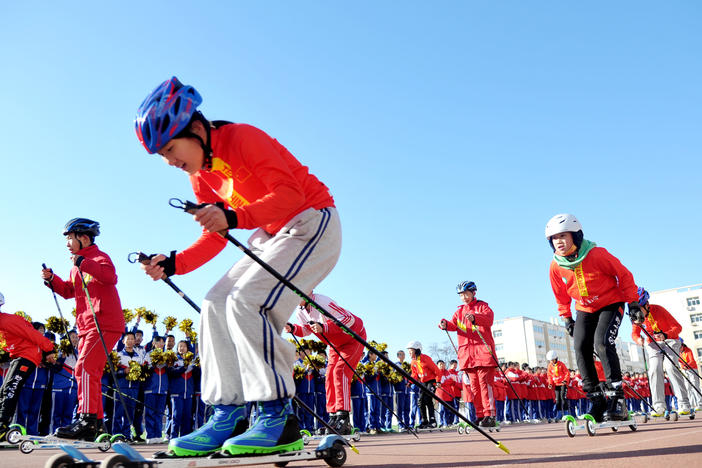 Students from the Youth Winter Olympic Sports School perform ice and snow gymnastics during an event marking the 100-day countdown to the 2022 Winter Olympic Games in Zhangjiakou, Hebei province, China, on Tuesday.