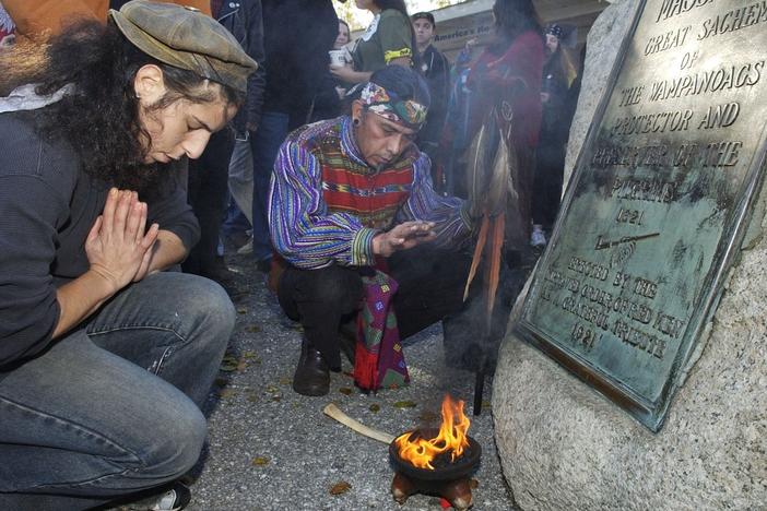 Supporters of Native Americans pause following a prayer during the 38th National Day of Mourning at Coles Hill in Plymouth, Mass., on Nov. 22, 2007. Denouncing centuries of racism and mistreatment of Indigenous people, members of Native American tribes from around New England will gather on Thanksgiving 2021 for a solemn National Day of Mourning observance.