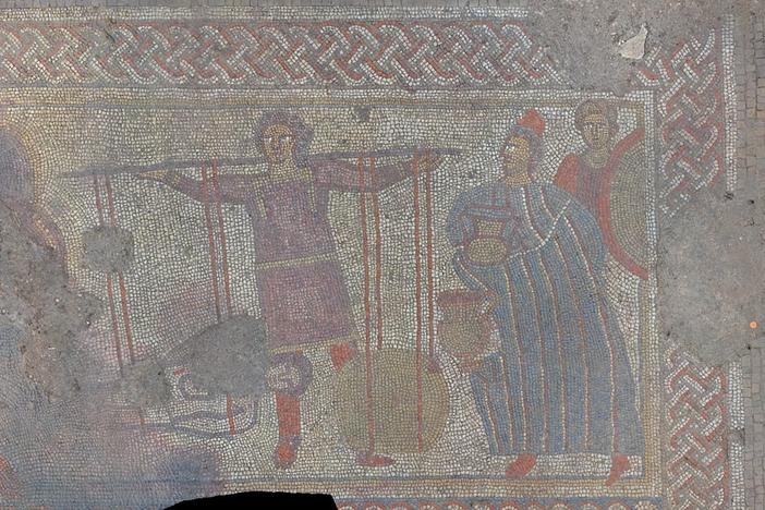 A panel of the mosaic discovered by a team of archaeologists in England. The researchers say it shows the body of Hector returning to his father, King Priam (right), in exchange for his weight in gold.