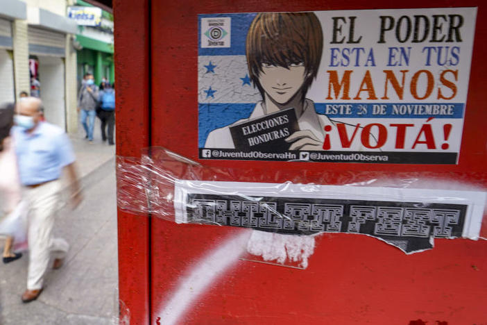 A sticker on a wall in Tegucigalpa, the Honduran capital, invites people to vote in the presidential elections on Sunday. Hondurans will elect a successor to President Juan Orlando Hernandez, who was first elected in 2013.