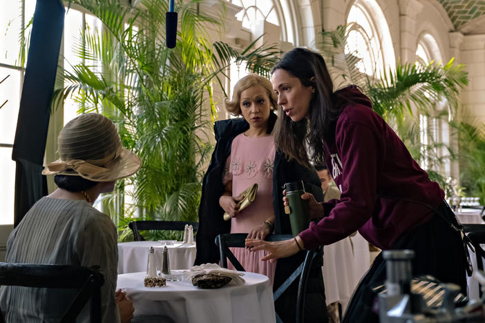 Rebecca Hall (right) works on the set of <em>Passing</em> with actors Ruth Negga (left) and Tessa Thompson.