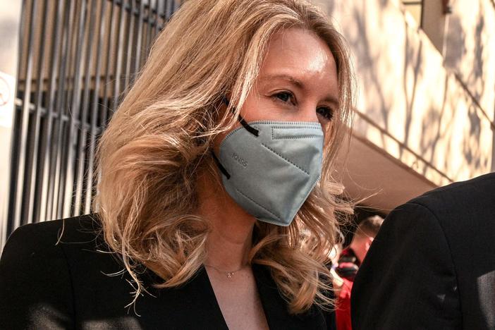 Former Theranos founder and CEO Elizabeth Holmes leaves the Robert F. Peckham Federal Building with her partner Billy Evans.