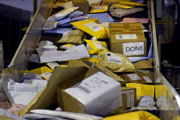 Parcels jam a conveyor belt at the United States Postal Service sorting and processing facility in Boston.