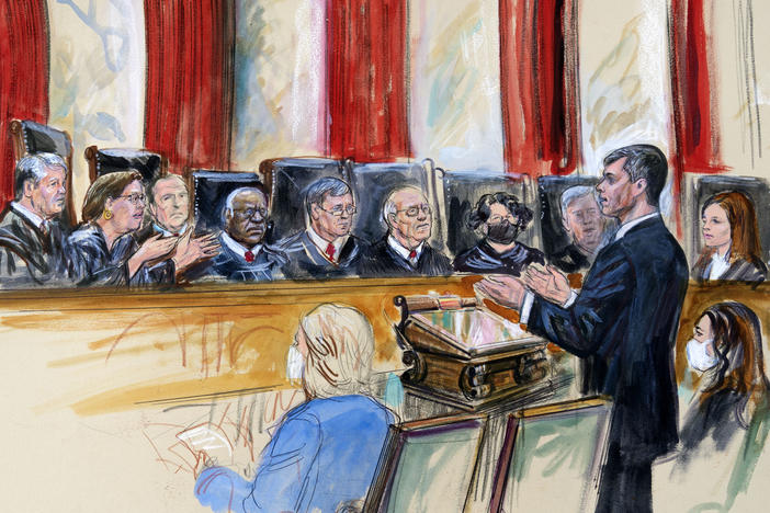 This artist sketch depicts Mississippi Solicitor General Scott Stewart, standing while speaking to the Supreme Court on Wednesday. Center for Reproductive Rights Litigation Director Julie Rikelman is seated right.