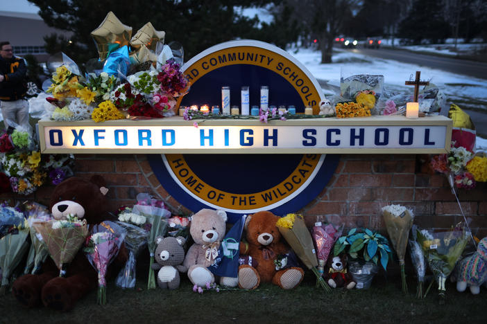 A makeshift memorial seen outside Oxford High School in Oxford, Mich., on Wednesday honors the four students who were fatally shot and seven people who were injured.