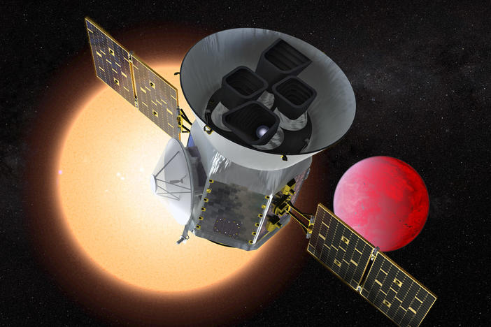 The planet-hunting telescope TESS depicted in front of a lava world orbiting a small red star.