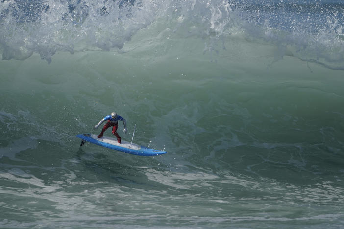 A remote-controlled RC surfer riding a king tide wave during the astronomical event last year, in Huntington Beach, Calif. The National Weather Service says the California coast will see unusually high and low tides over the weekend.