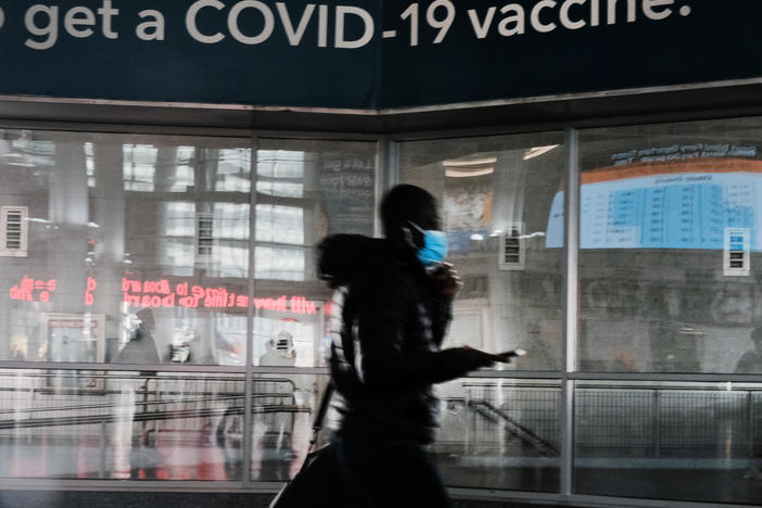 A sign urges people to get the Covid vaccine at the Staten Island Ferry terminal on November 29, 2021 in New York City.