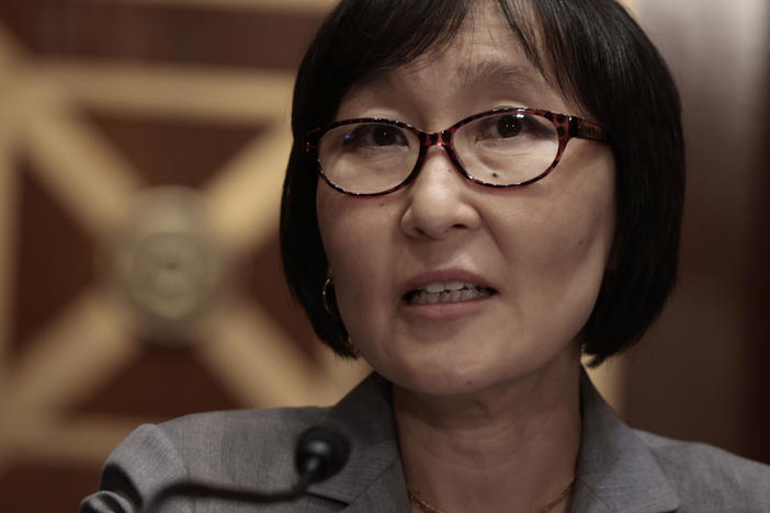 Saule Omarova addresses the Senate Banking Committee during her nomination hearing on Nov. 18 to head the Office of the Comptroller of the Currency. Omarova withdrew her nomination on Tuesday after facing opposition from Republicans and some moderate Democrats.