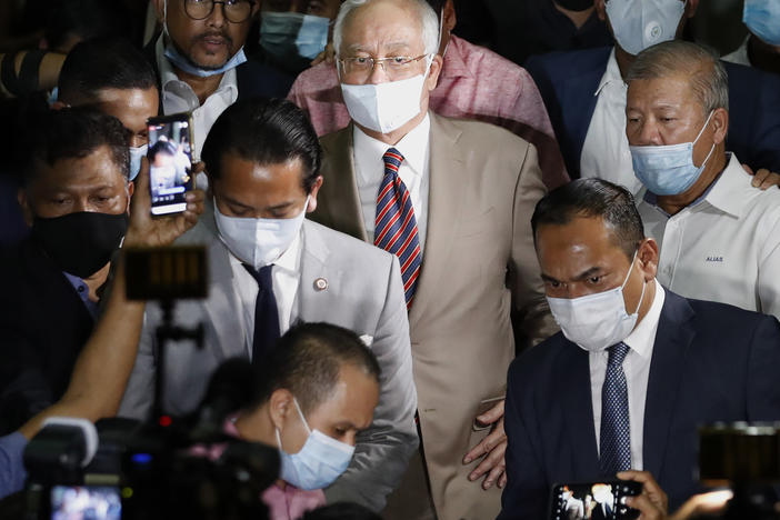 Former Malaysian Prime Minister Najib Razak, center, leaves a court house in Kuala Lumpur, Malaysia on July 28, 2020. Malaysia's Appeal Court today upheld his conviction linked to the 1 MDB scandal.