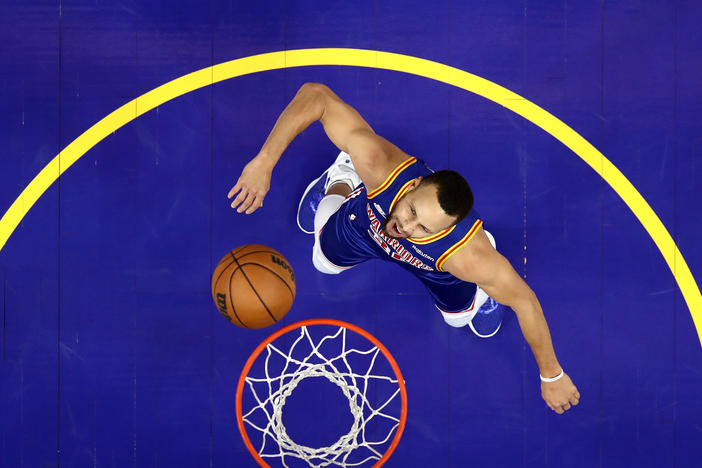 Steph Curry of the Golden State Warriors reacts after the Phoenix Suns missed a basket during a game Dec. 3.