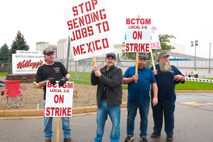 Kellogg's Cereal plant workers demonstrate in front of the Kellogg's Cereal Plant on Oct. 7, 2021 in Battle Creek, Mich. Workers at Kellogg's cereal plants are striking over the loss of premium health care, holiday and vacation pay, and reduced retirement benefits.