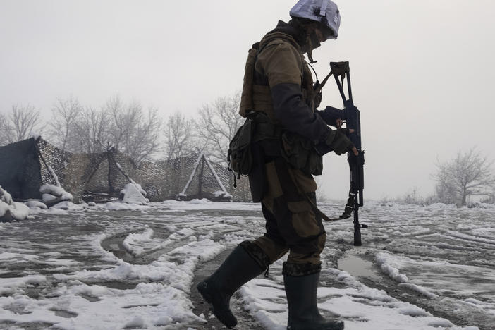 A Ukrainian soldier walks at the line of separation from pro-Russian rebels near Popasna, Donetsk region, Ukraine, on Tuesday.