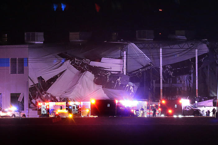 The roof of an Amazon distribution center is partially collapsed after being hit by an apparent tornado on Friday, Dec. 10, 2021 in Edwardsville, Ill.