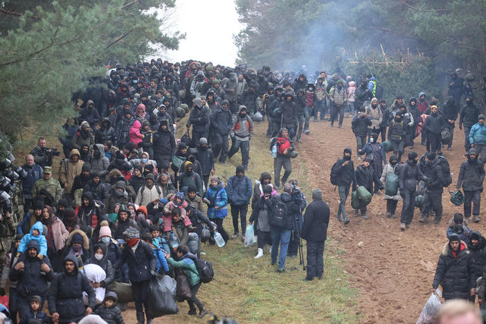 Migrants head toward a border checkpoint on the Belarusian-Polish border on Nov. 15. U.S. officials have accused Belarusian leader Alexander Lukashenko of taking advantage of desperate migrants.