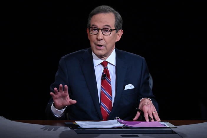 Chris Wallace of Fox News moderates a 2020 presidential debate. Wallace says he's leaving the network after 18 years and is "ready for a new adventure."