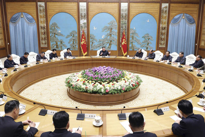 In this April 2020 file photo provided by the North Korean government, Kim Jong Un, center top, attends a politburo meeting of the ruling Workers' Party of Korea in Pyongyang.