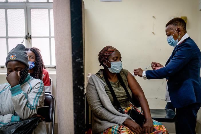 A woman is vaccinated against COVID-19 at a clinic in Johannesburg on Dec. 6. A new study from South Africa looks at the effectiveness of the Pfizer vaccine in preventing infection and severe disease.