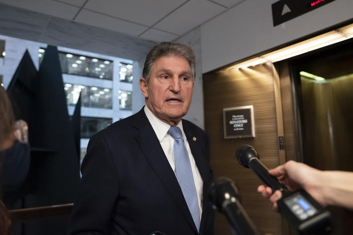 Sen. Joe Manchin, D-W.Va., leaves his office after speaking with President Biden about his long-stalled domestic agenda, at the Capitol on Monday.